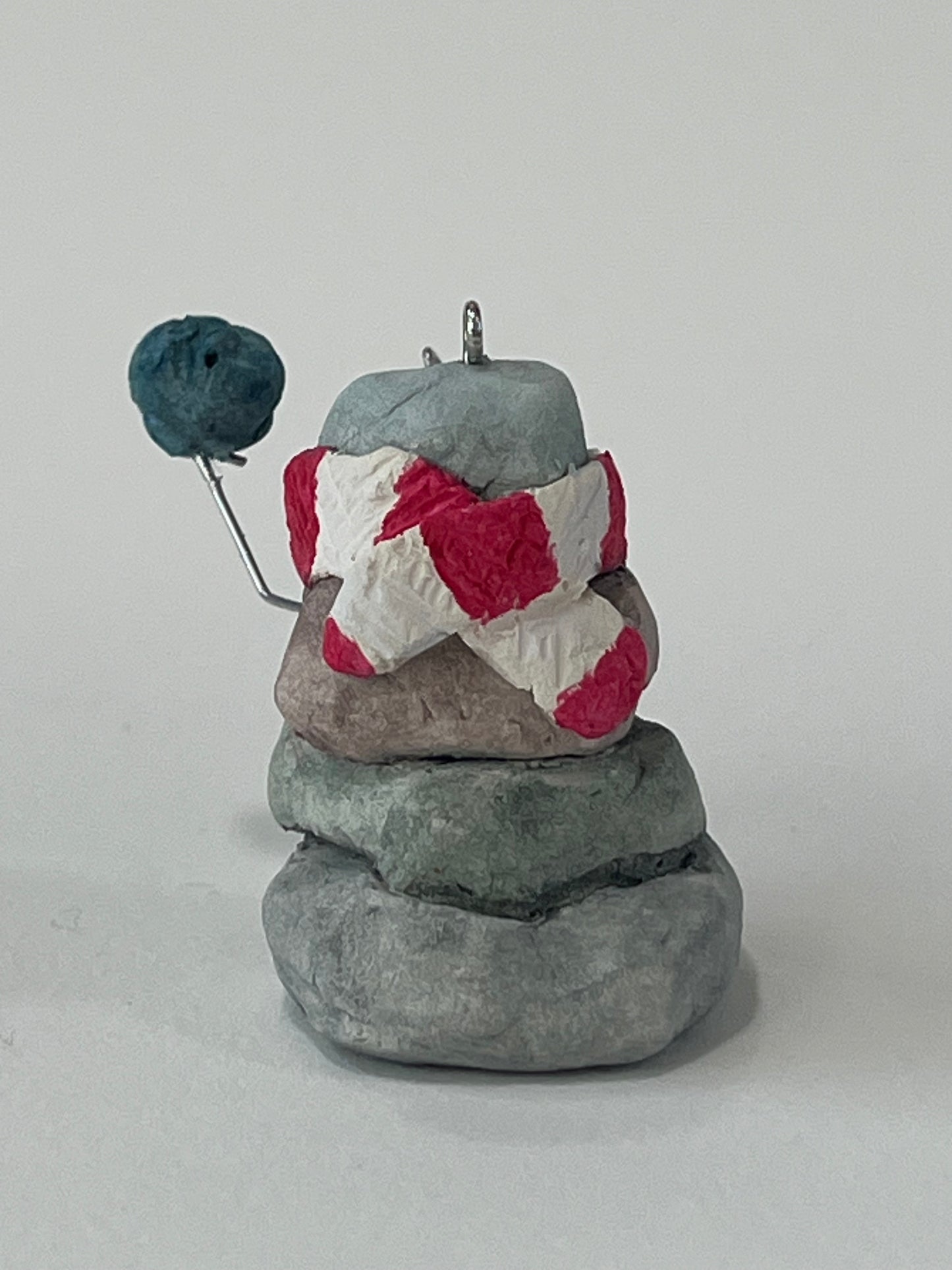 Curious Cairn-blue bird in hand