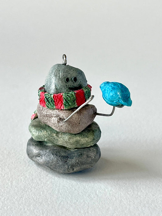 Curious Cairn-blue bird on hand