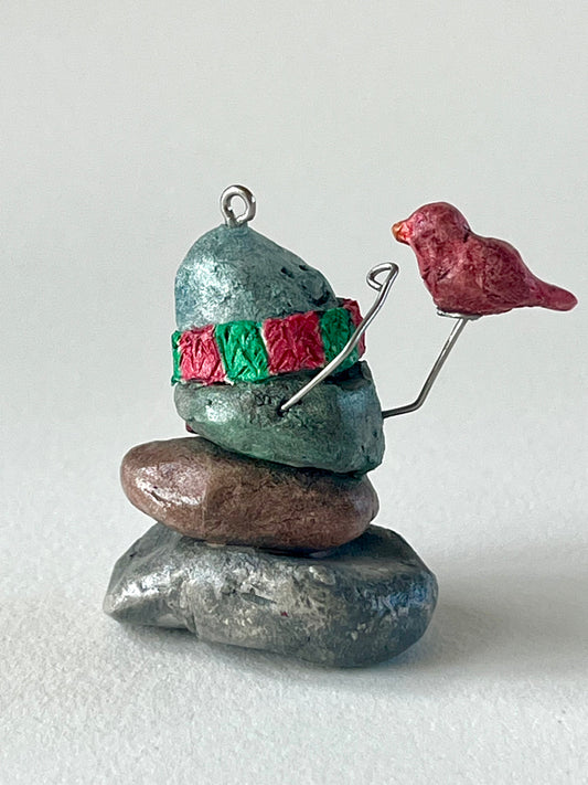 Curious Cairn-red bird on hand