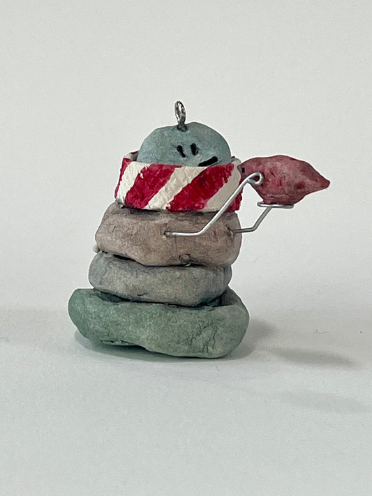 Curious Cairn-red bird in hand