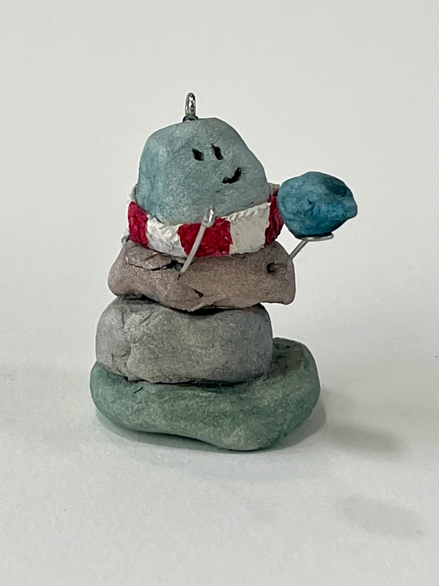 Curious Cairn-blue bird in hand