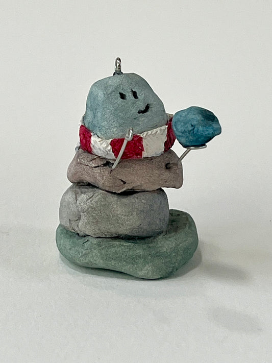 Curious Cairn-blue bird in hand